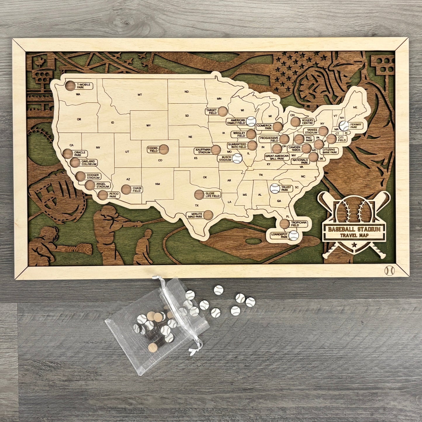 Wooden map of baseball stadiums with a bag of baseball tokens.