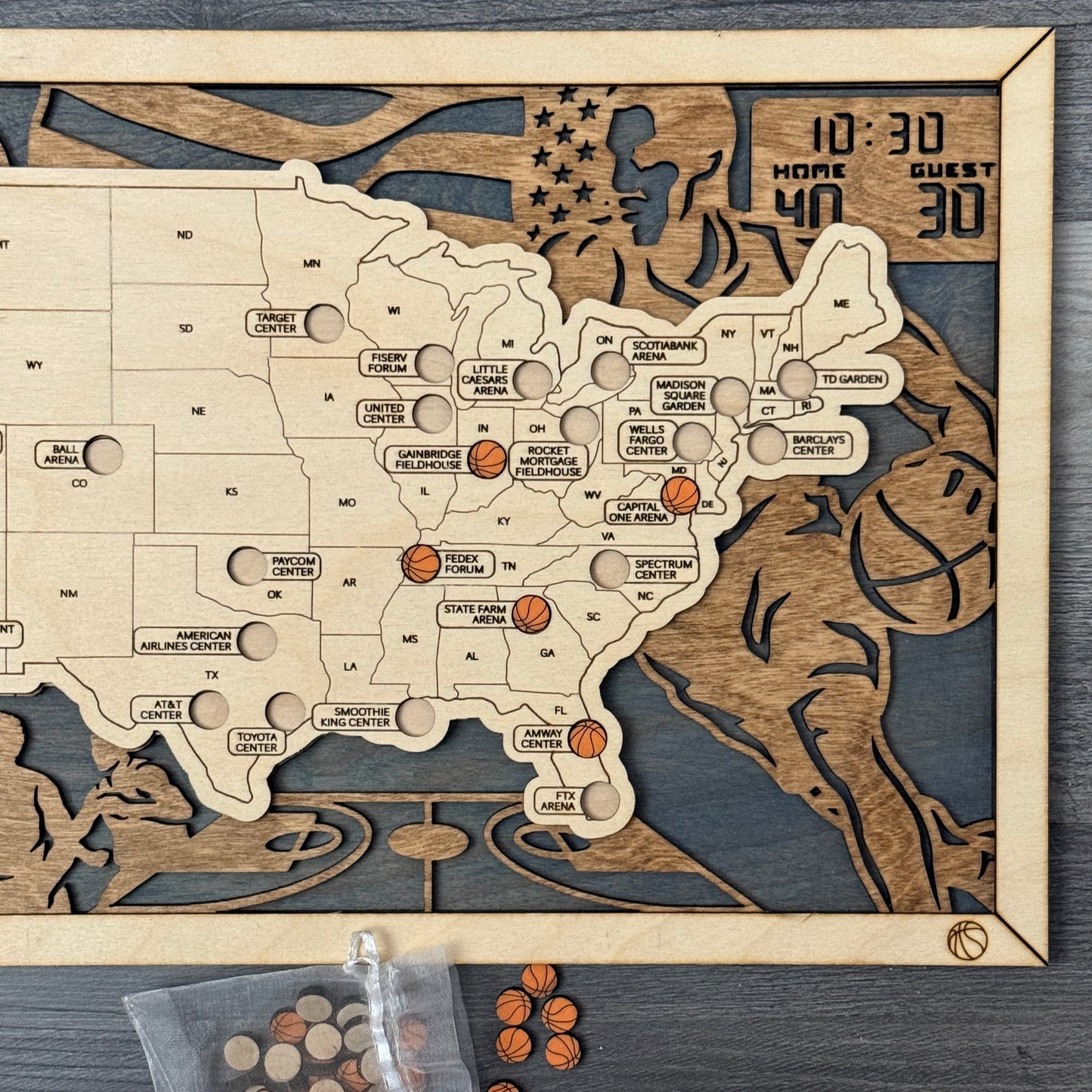Wooden map of the United States with engraved details on a dark surface