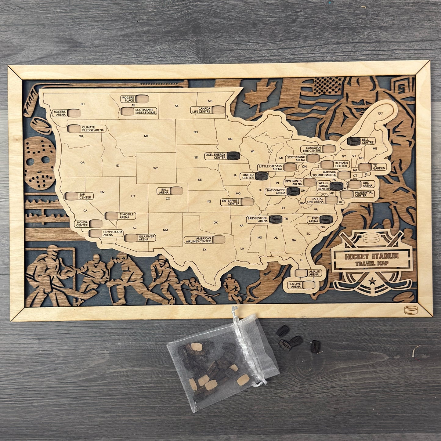 Wooden map of hockey stadiums on with a bag of hockey puck tokens.